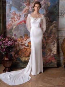 Long sleeve fit and flare wedding dress with an illusion off-the-shoulder lace neckline; available in ivory