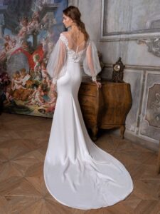 Long sleeve fit and flare wedding dress with an illusion off-the-shoulder lace neckline