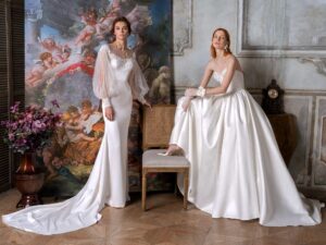 Strapless Mikado ballgown with a bustier-style bodice, lace embroidery and buttons down the skirt | Long sleeve fit and flare wedding dress with an illusion off-the-shoulder lace neckline