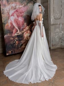 Mini wedding dress with a detachable A-line skirt; available in cream