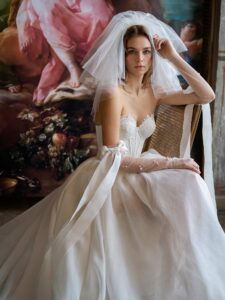 Mini wedding dress with a detachable A-line skirt; available in cream