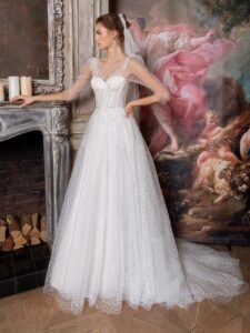 Sequinned lace ballgown with an illusion bustier-style bodice and puff long sleeves
