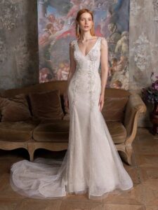 Sparkly fit and flare wedding dress with floral embroidery and shoulder beading; available in cream