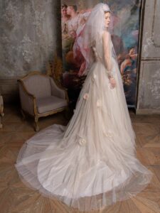 Shimmering tulle peach ballgown with draped sweetheart bodice and long bishop sleeves