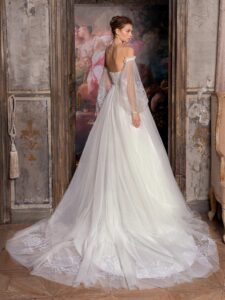 Strapless ballgown wedding dress with plunging V-neckline, floral applique and detachable bishop sleeves