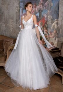 Style #2320L, pearl skirt A-line wedding dress with draped Atlas bodice and bow details; available in ivory