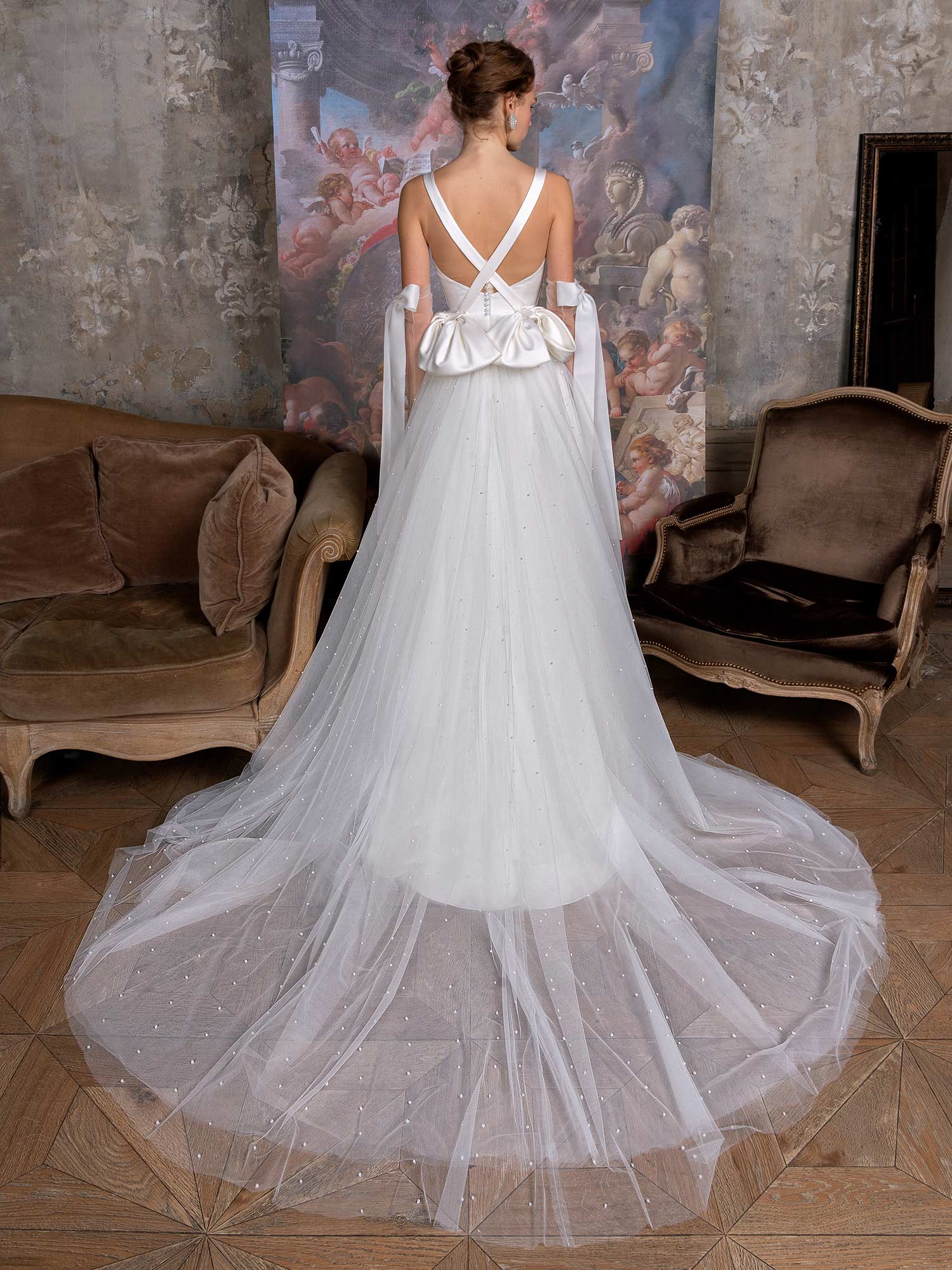 Style #2320L, pearl skirt A-line wedding dress with draped Atlas bodice and bow details; available in ivory