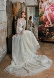 Style #2321L, high-neck A-line wedding dress with long sleeves and floral embroidery; available in mint-powder, ivory