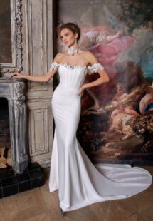 Style #2322L, simple fit and flare wedding gown with an off-the-shoulder sequinned lace decor; available in ivory