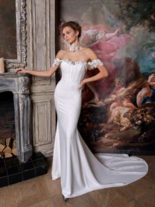 Simple fit and flare wedding gown with an off-the-shoulder sequinned lace decor