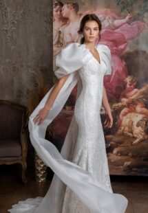 Style #2323L, voluminous sleeve fit and flare wedding dress with cape straps; available in ivory