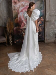 Voluminous sleeve fit and flare wedding dress with cape straps