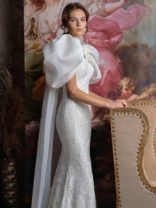Voluminous sleeve fit and flare wedding dress with cape straps