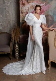 Style #2323L, voluminous sleeve fit and flare wedding dress with cape straps; available in ivory