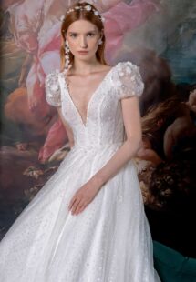 Style #2324L, cap sleeve A-line wedding dress with plunging V-neckline; available in ivory