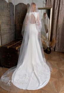 Style #2325L, fit and flare wedding dress with long balloon sleeves and open back; available in ivory