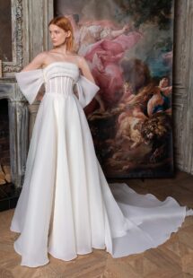 Style #2326L, off-the-shoulder A-line wedding dress with a draped bustier bodice; available in ivory