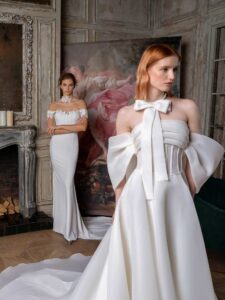 Off-the-shoulder A-line wedding dress with a draped bustier bodice