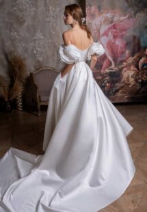 Style #2327L, off-the-shoulder A-line wedding dress with short puff sleeves and pockets; available in ivory