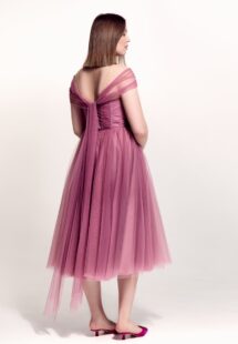 Style #742а, tulle A-line cocktail dress with off-the-shoulder straps, pleated corset and beaded illusion neckline; available in midi or maxi length; in pink, purple, blue, cherry, powder pink, black or ivory