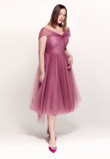 Style #742а, tulle A-line cocktail dress with off-the-shoulder straps, pleated corset and beaded illusion neckline; available in midi or maxi length; in pink, purple, blue, cherry, powder pink, black or ivory