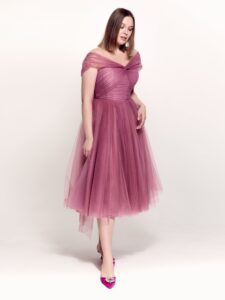 Style #742а, tulle A-line cocktail dress with off-the-shoulder straps, pleated corset and beaded illusion neckline; available in midi or maxi length; in pink, purple, blue, cherry, powder pink, black or ivory