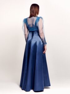 Style #745, square neck evening gown with thick straps, corset back, and removable long-sleeve bolero with floral decor; available in steel-dark blue, black, eggplant, crimson or ivory