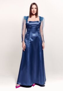 Style #745, square neck evening gown with thick straps, corset back, and removable long-sleeve bolero with floral decor; available in steel-dark blue, black, eggplant, crimson or ivory