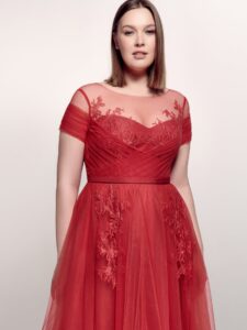 Style #746а, short sleeve A-line evening dress with illusion off-the-shoulder neckline, lace embroidery and tulle skirt; available in midi or maxi length; in cherry, powder pink, purple or black