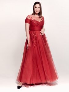 Style #746а, short sleeve A-line evening dress with illusion off-the-shoulder neckline, lace embroidery and tulle skirt; available in midi or maxi length; in cherry, powder pink, purple or black