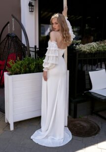 Style #15002b, strapless fitted gown with a slit and detachable balloon sleeves; available in ivory