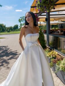 Satin A-line wedding dress with a slit and pockets