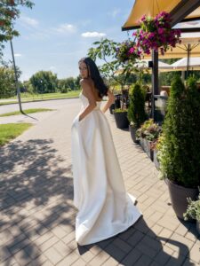 Satin A-line wedding dress with a slit and pockets
