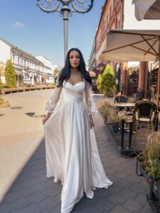 Long-sleeved wedding dress with butterfly decor; available in ivory, ivory-peach