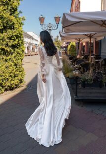 Style #15004, long-sleeved wedding dress with butterfly decor; available in ivory, ivory-peach