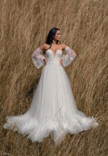 Style #15006, A-line wedding dress with 3D butterfly decor and detached bishop sleeves; available in ivory
