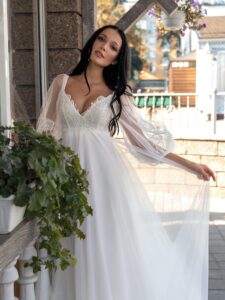 High-waisted A-line wedding dress with long sleeves