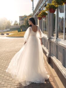High-waisted A-line wedding dress with long sleeves