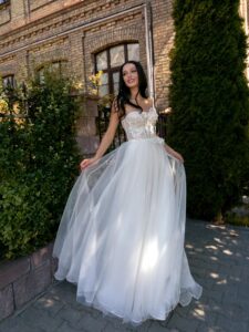 Strapless A-line wedding dress with a bustier bodice and floral applique