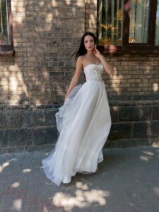 Strapless A-line wedding dress with a bustier bodice and floral applique