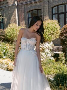 Strapless A-line wedding dress with a bustier bodice and floral applique