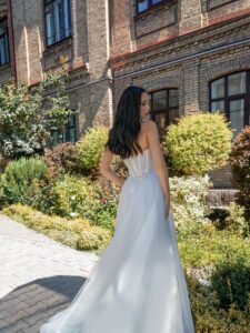 Strapless A-line wedding dress with a bustier bodice and floral applique