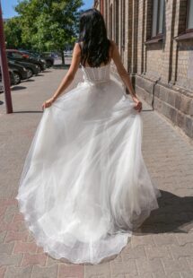 Style #15011, strapless A-line wedding dress with a bustier bodice and floral applique; available in ivory