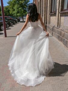 Strapless A-line wedding dress with a bustier bodice and floral applique