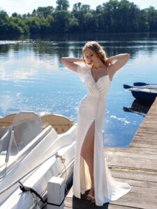 Sheath wedding dress with a slit and ruffles