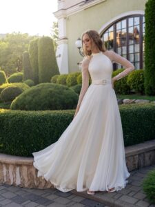 Halter neck chiffon wedding gown with long pleated sleeves