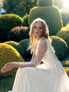 Halter neck chiffon wedding gown with long pleated sleeves