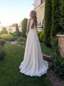 Halter neck chiffon wedding gown with long pleated sleeves