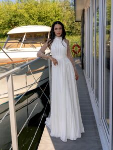 Halter neck sheath wedding dress with long sleeves and pearls