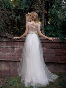 Lace A-line wedding dress with illusion neckline, flowers and butterfly decor